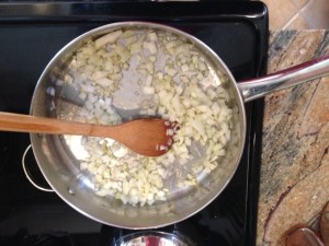 Sauteing garlic and onions in olive oil.