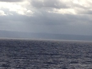 A tiny white line in the middle of the image - is the lighthouse.