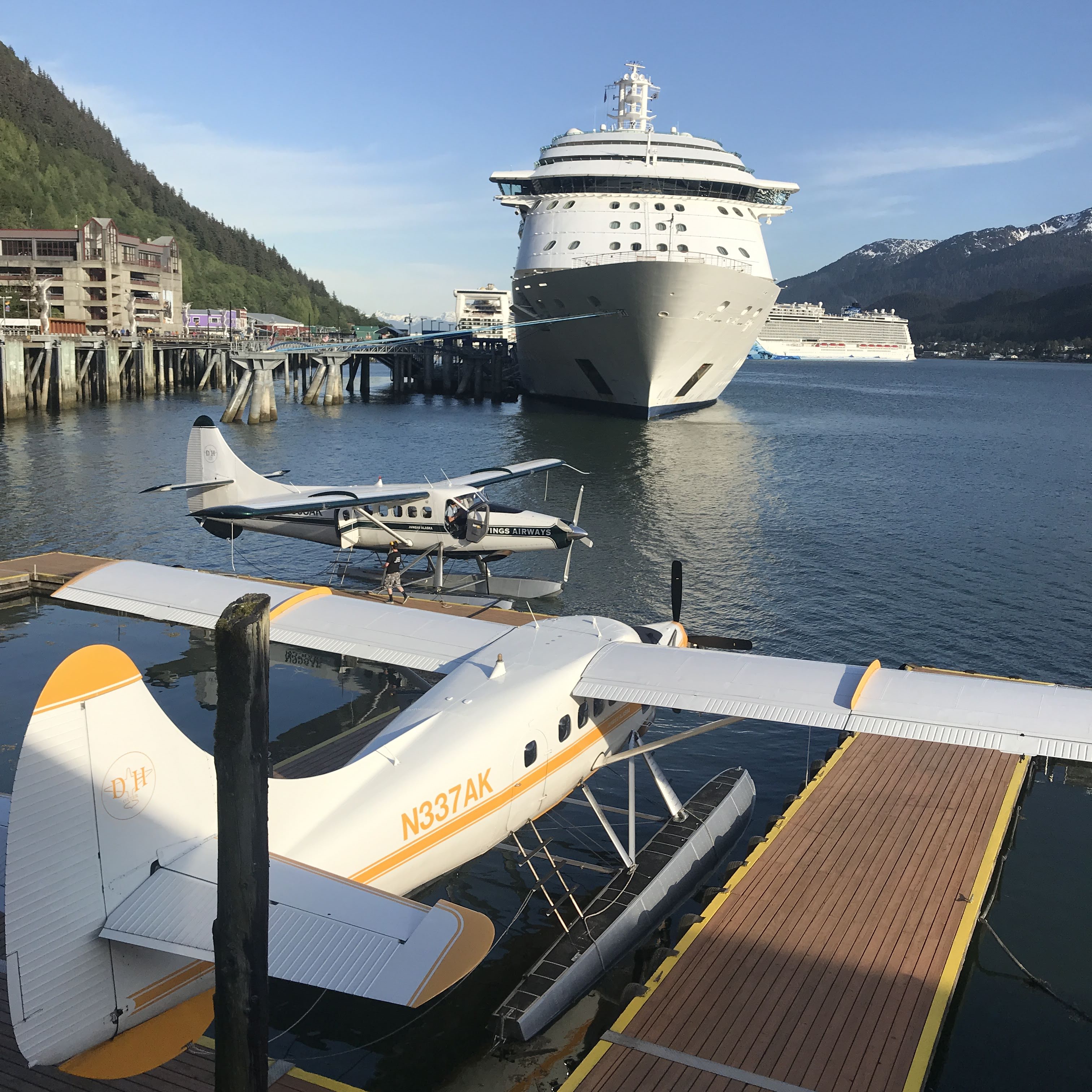 Several cruise ships and floatplanes dot the harbor in Juneau.